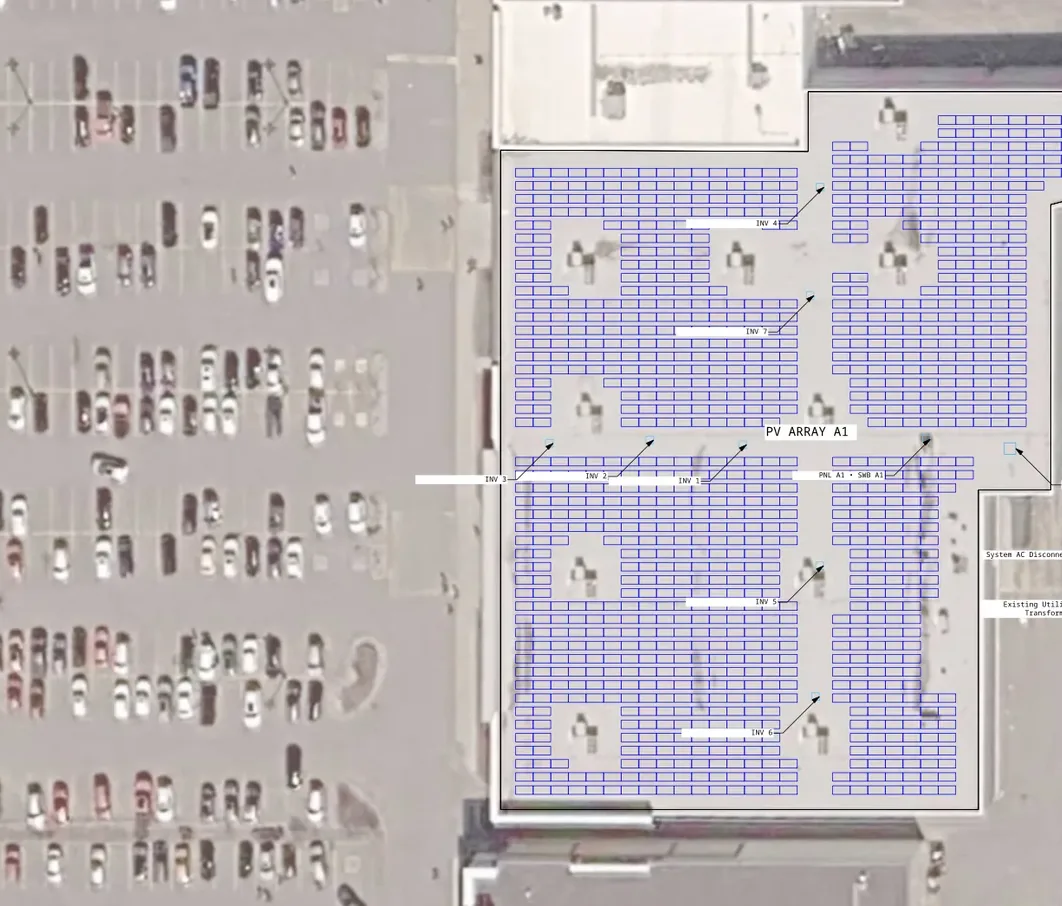 A detail of the G100 site plan sheet: the rooftop array on satellite imagery with its inverters labeled